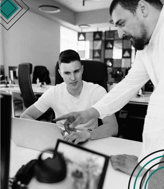 Evolt engineers collaborating around a desk in the Sarajevo office